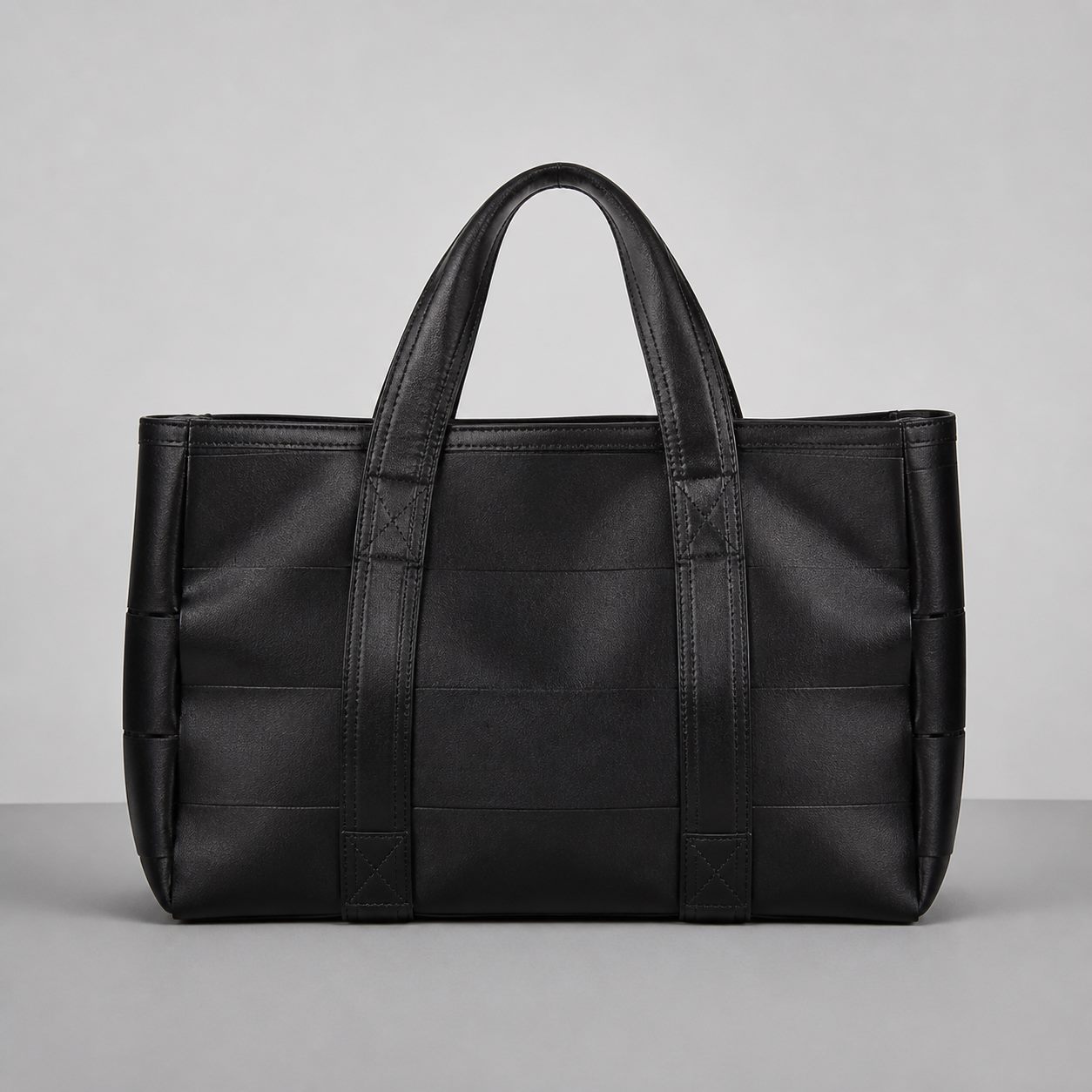 Black seatbelt-webbing tote bag without text